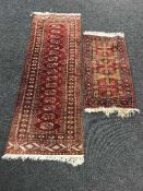 An Afghan fringed woollen runner and another rug