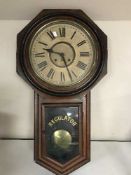 A late Victorian American Regulator clock with pendulum