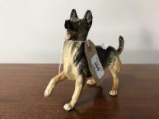 A Royal Doulton china figure : Alsatian (prancing with front right paw raised), height 15 cm.