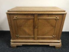 An early 20th century oak low cabinet