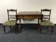 A late 19th century mahogany drop end sofa table and pair of dining chairs