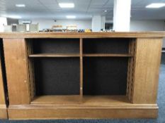 An early 20th century oak double sided library bookcase