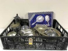 A basket of assorted plated ware, boxed floral dressing table set,