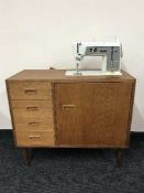 Singer sewing machine in cabinet
