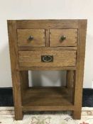 A contemporary oak side table