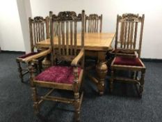 An oak pull out dining table and six chairs
