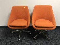 A pair of mid 20th century swivel bucket chairs