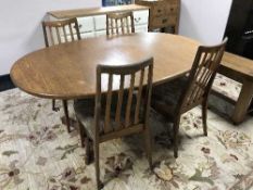 A teak G Plan extending table and four chairs