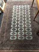 A fringed woollen Bokhara rug brown ground