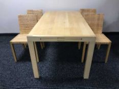 A six piece beech dining room suite