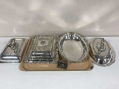 Three plated entree dishes with covers