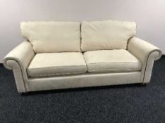 A two seater settee in beige