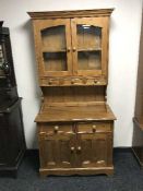 A pine glazed door kitchen dresser