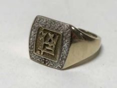 A 9ct gold diamond set Gentleman's ring, 6.8g.