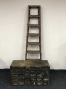 An industrial twenty four drawer metal chest and pair of metal ladders