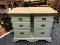 A pair of painted pine bedside chest of three drawers,