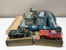 Twelve boxed Scalectric racing cars ,