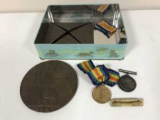 An interesting group of militaria comprising a First World War pair,