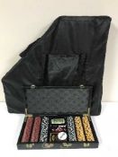 A folding table top poker table and two cases of poker chips & accessories