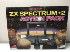 A boxed Sinclair ZX Spectrum + 2 Action Pack