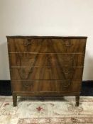 A walnut four drawer chest