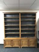 A large set of late 19th century open shelves with cupboards below