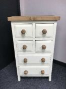 A painted pine chest of six drawers, width 55 cm.