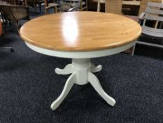 A contemporary pine topped extending table