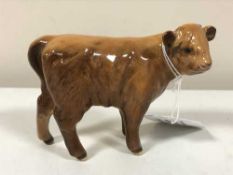 A Beswick highland calf