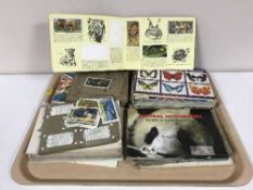A collection of assorted tea and cigarette card albums and cards