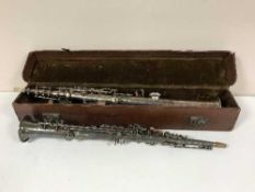 A leather case of two Soprano saxophones