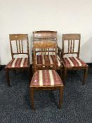 A set of four nineteenth century continental inlaid mahogany dining chairs