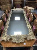 An impressive 19th century Florentine style ornate gilt-framed mirror, 282 cm x 100 cm.