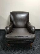 A contemporary brown leather Club style armchair