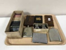 A tray of opera glasses, hip flasks,