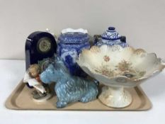 A tray of Goebel figure, pottery West Highland terrier, Ringtons caddy,
