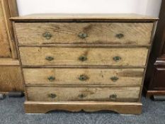 A 19th Century continental inlaid oak chest of four drawers,