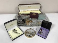 A cut glass tray of various costume jewellery, dress rings,