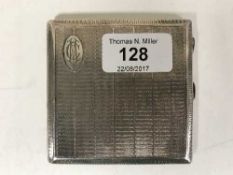 A silver cigarette case with engine turned decoration, 3.