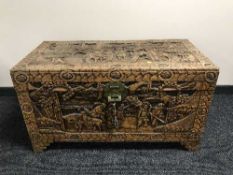A heavily carved camphor wood chest