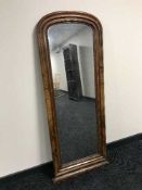 A late 19th century walnut hall mirror