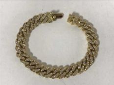 An 18ct gold diamond set tennis bracelet, retailed by Garrards, set with 189 diamonds,