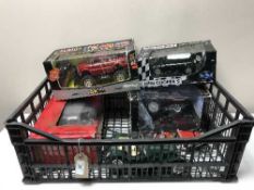 A crate of two boxed large scale die cast vehicles,
