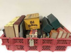 A basket of Old Holborn tin of stamps, books, guides relating to stamps,