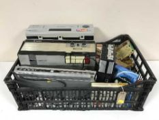 A basket of reel to reel and tapes, VCR, DVD player,