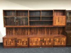 A mid twentieth century rosewood triple section bureau bookcase
