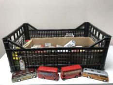 A crate of die cast vehicles and buses