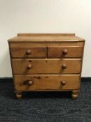 An antique pine six drawer chest