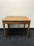 A teak mosaic occasional table