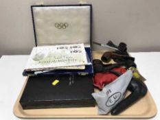 A tray of pipes, stamps,